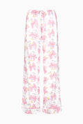 Women's pajama pants in pink-and-white bow print with elastic waist