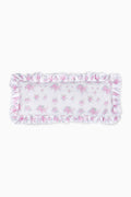 Blush pink ruffled lumbar pillow with floral print and frilled border