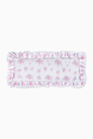 Blush pink ruffled lumbar pillow with floral print and frilled border