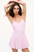 Pink active dress with spaghetti straps and allover bow pattern