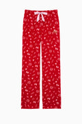Red flannel pajama pants with bow drawstring, allover heart pattern, center button placket