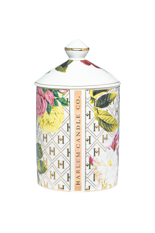 Floral ceramic candle jar with gold-trimmed lid knob