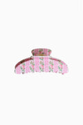 Large pink floral claw clip with ruffled edges and wide grip
