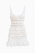 Off-white crochet mini dress flat lay, spaghetti straps, ruffled hem