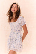 Girls light blue floral dress with square neckline, puff sleeves, and lace hem
