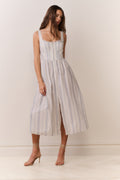 Light blue pinstripe midi dress with bustier bodice, thin straps, and front slit