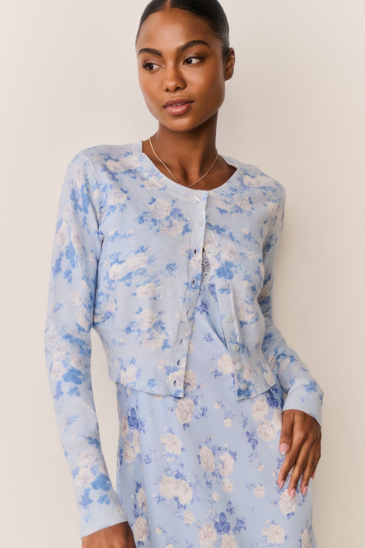 Light blue floral print cotton cardigan with button-front and long sleeves