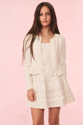 Ivory knit cardigan with ruffle trim, long sleeves, and button front