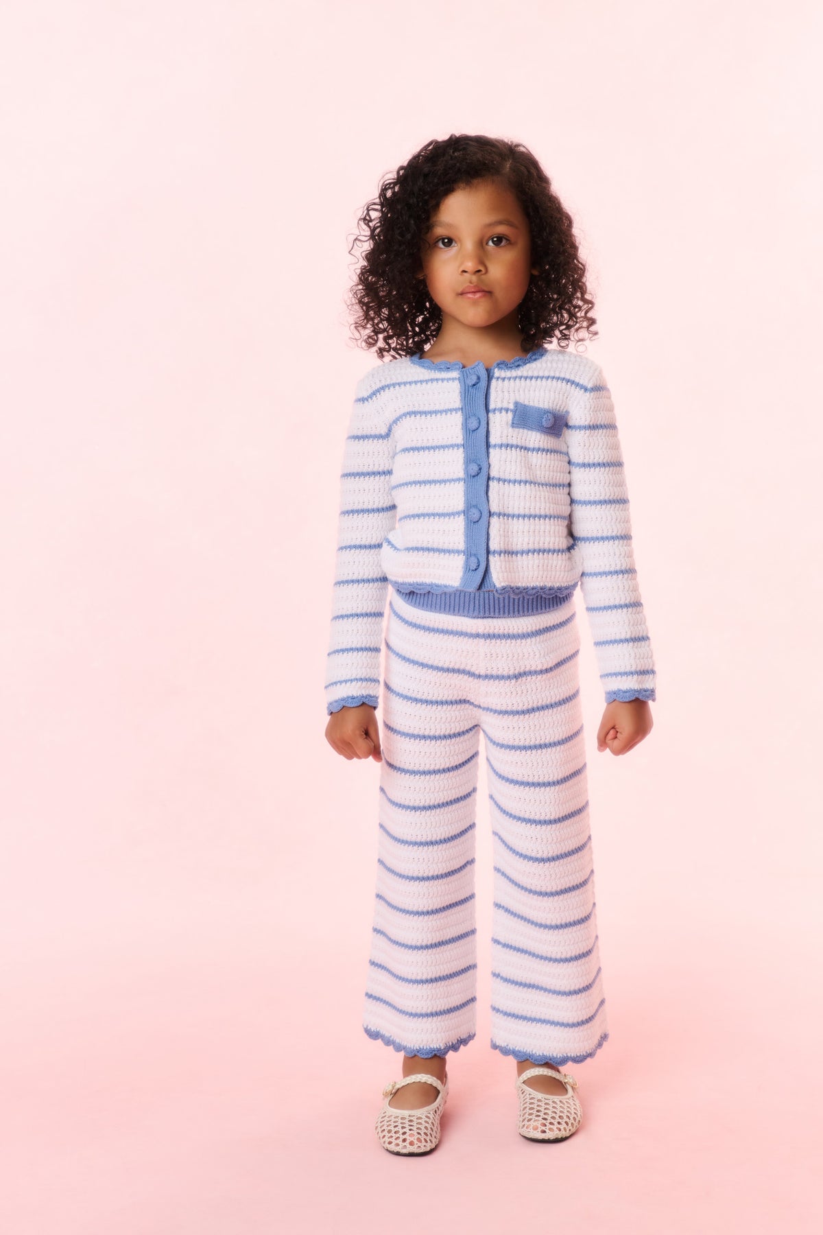 Girls striped crochet cardigan front view, light blue and white, buttons and chest patch pocket