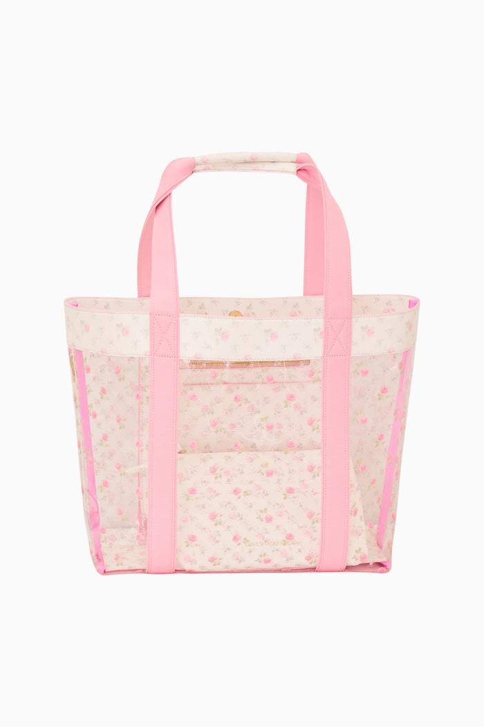 Ditsy floral PVC tote with clear exterior, pink handles, and front slip pocket