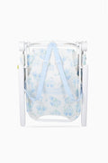 Blue floral ikat beach chair with folded canopy mesh and white protective sides