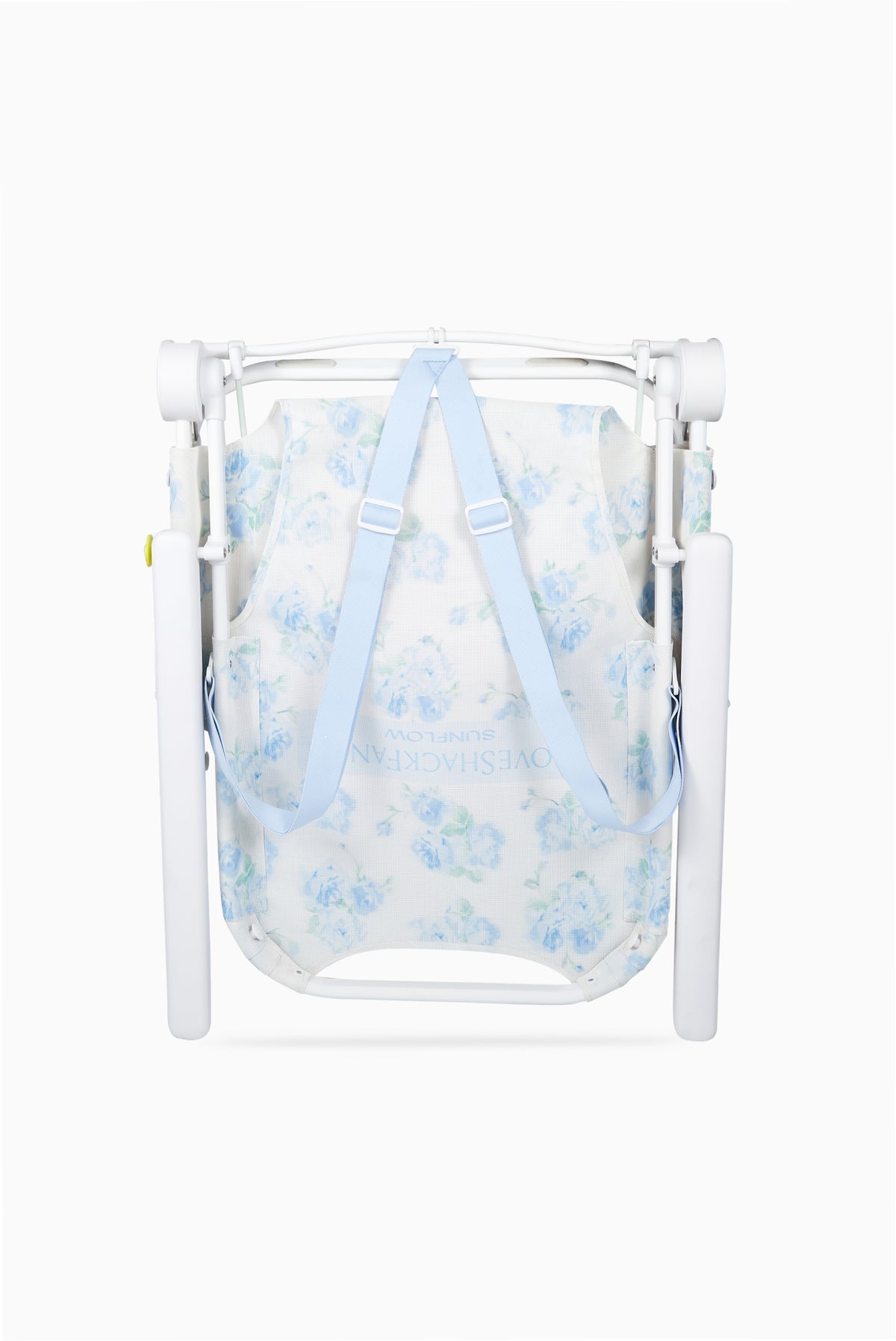 Blue floral ikat beach chair with folded canopy mesh and white protective sides