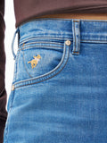 Medium wash cowboy cut jeans with embroidered front pocket and coin pocket