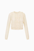 Ivory eyelet ruffle cardigan with long sleeves and button-front