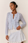 Floral cotton mini skirt with scalloped lace hem, styled with light blue cardigan