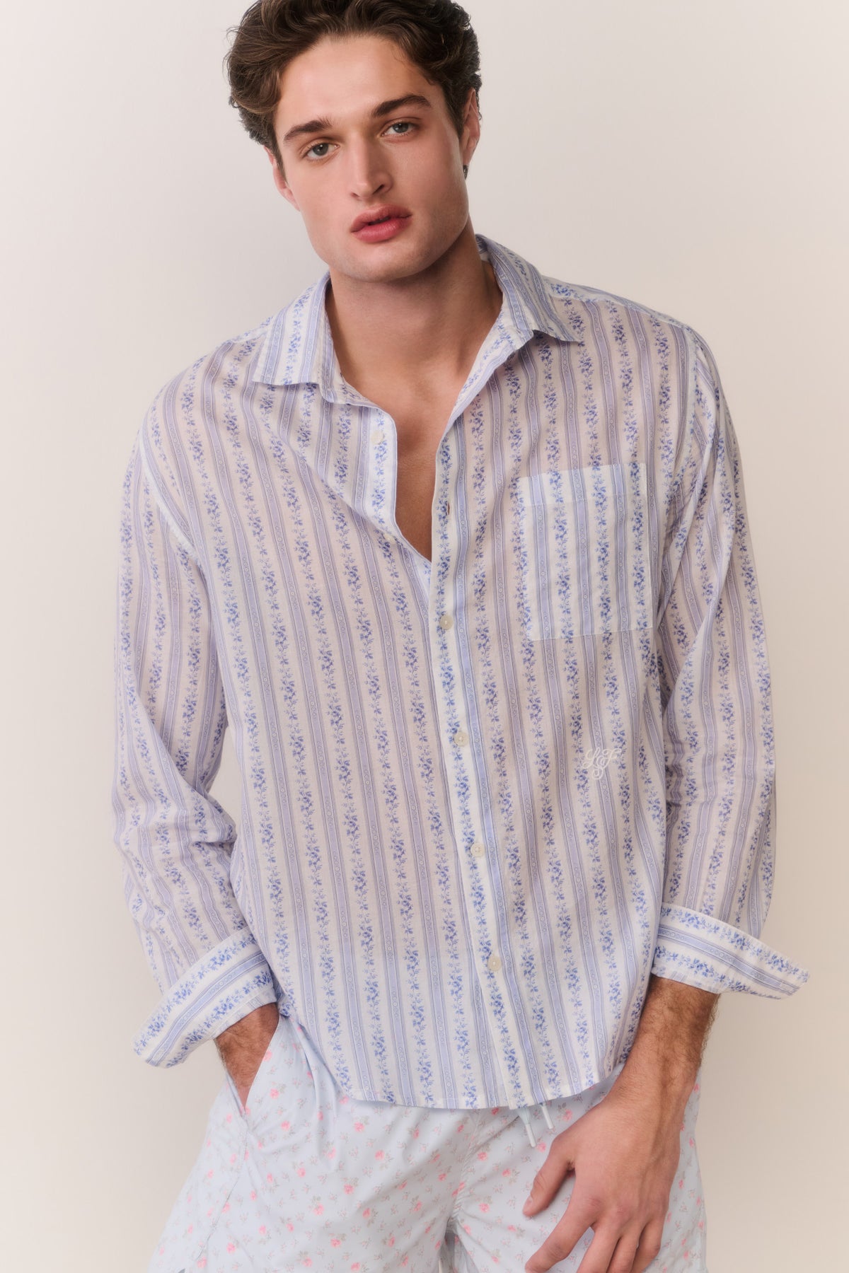 Light blue patterned cotton unisex shirt, button-up collar, long sleeves, front view