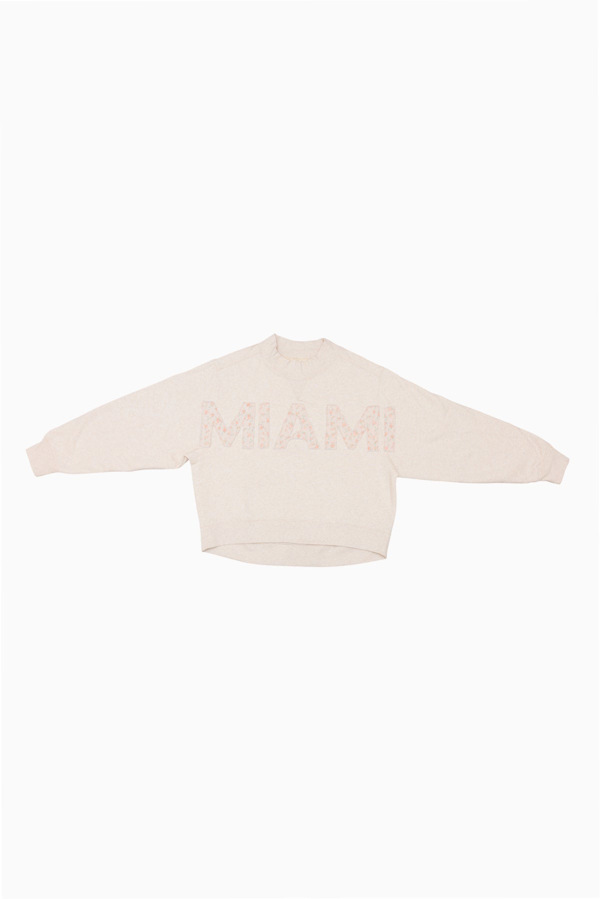 Cream mockneck crew sweatshirt with subtle pink dotted lettering at center