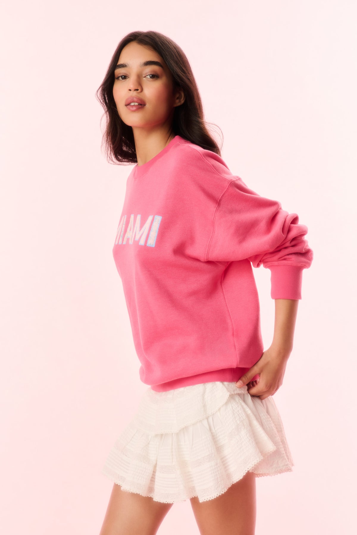 Pink pullover sweatshirt with MIAMI graphic and ribbed crew neckline