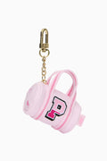 Pink mini duffle keychain charm with embroidered P logo and gold chain clasp.