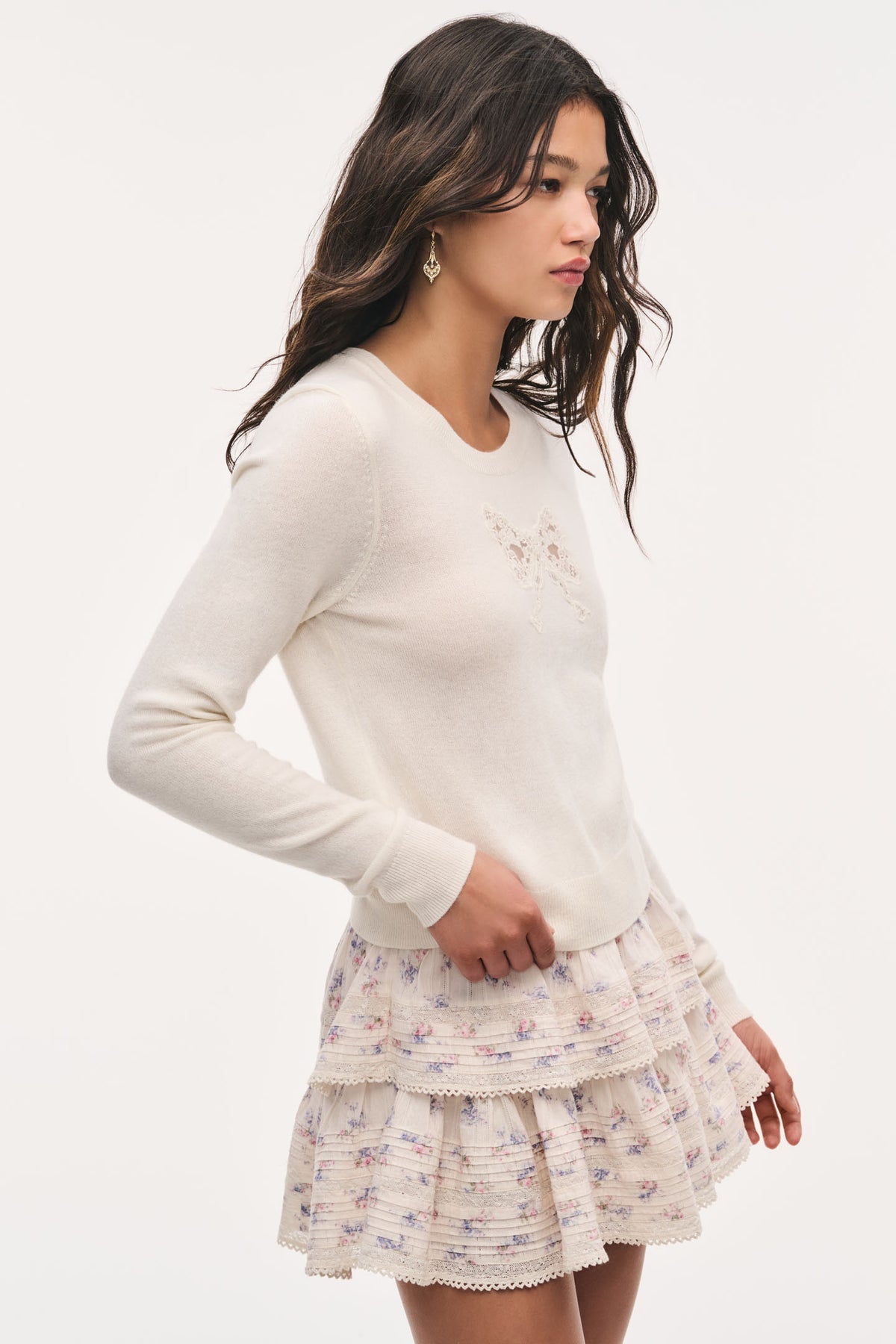 Ivory wool sweater with lace bow detail at chest, long sleeves, crew neck