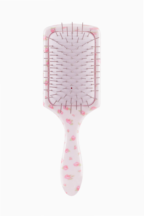 Pink floral mini detangling hair brush with pin tips on clear cushion