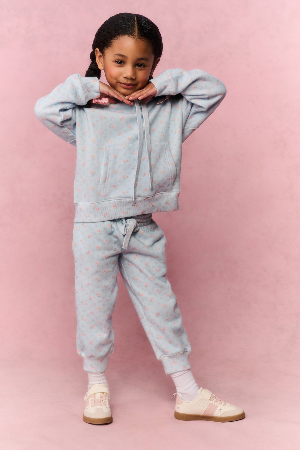 Girls' mini hoodie front view, light blue small print, hood with drawstrings and pouch pocket