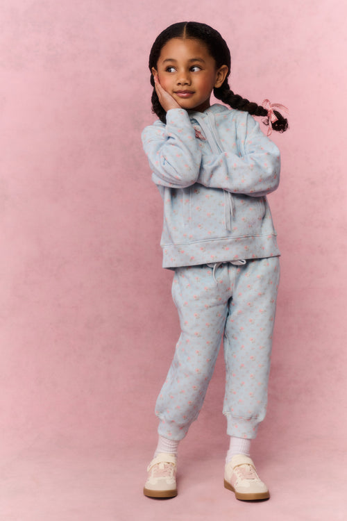 Girls floral light-blue sweatpants, front view with drawstring waist and cuffed ankles