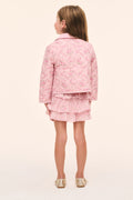 Girls' pink floral quilted jacket, back view with button placket and yoke