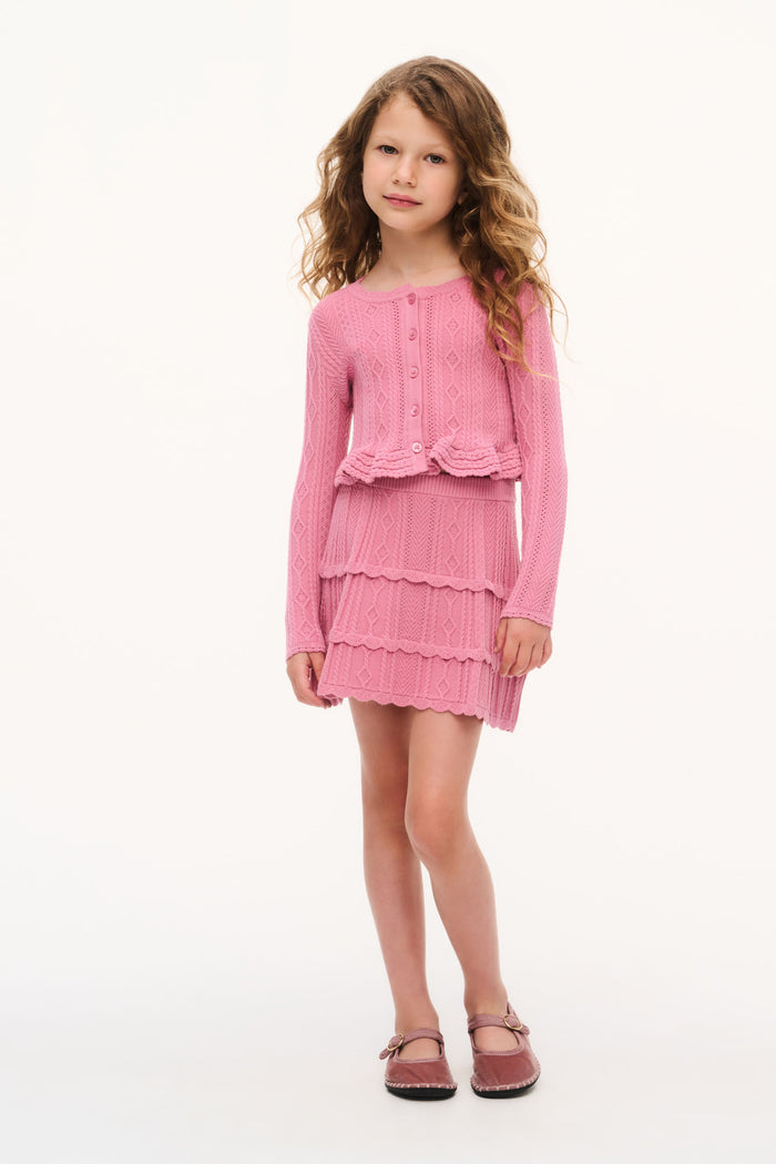 Peony pink girls pointelle stretch skirt with layered ruffle tiers, front view