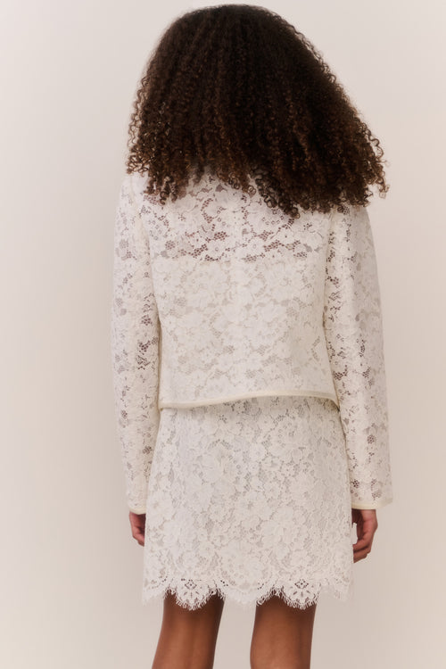 Ivory lace jacket back view with scalloped hem and fitted waist