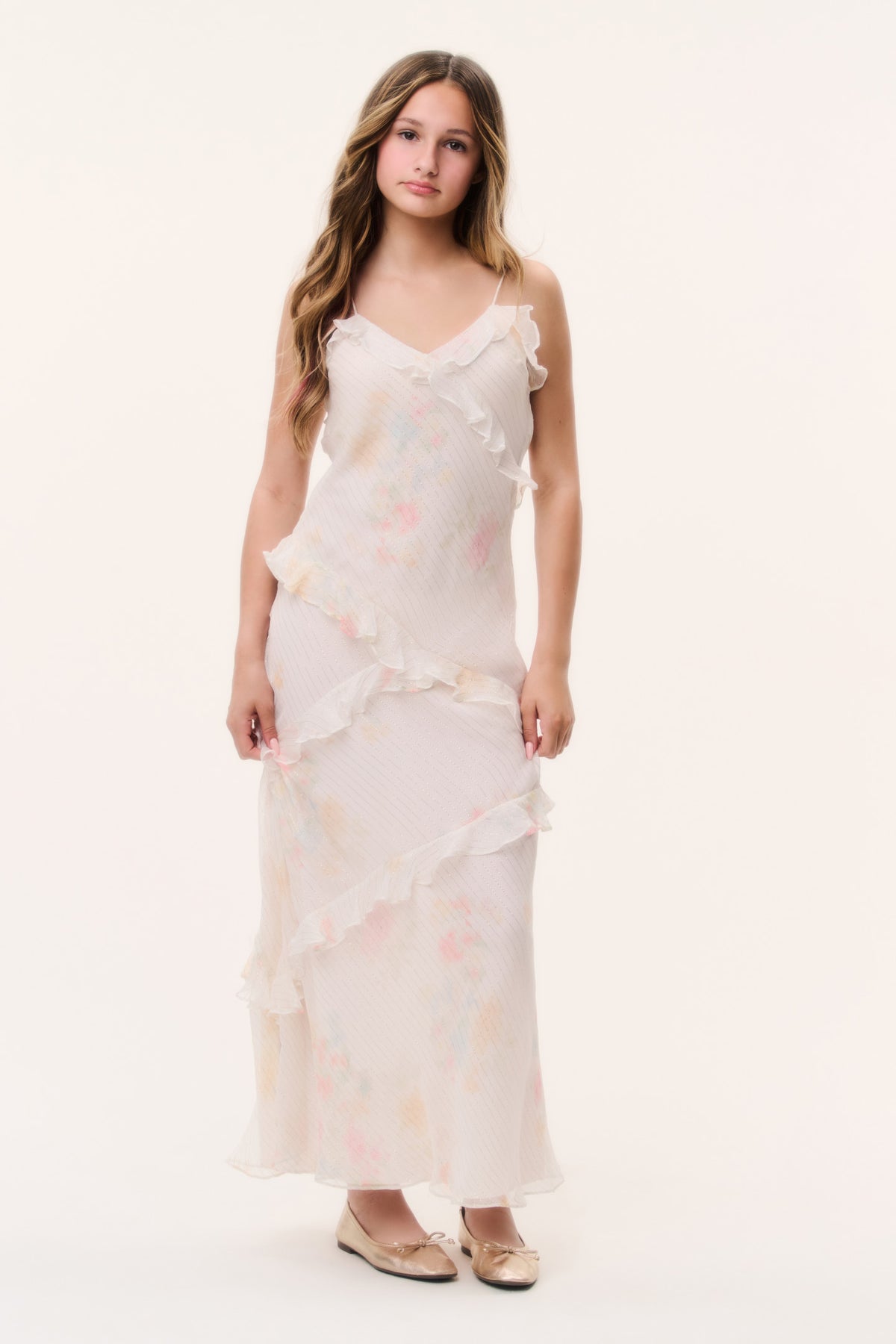 Tween silk mini dress with spaghetti straps, ruffled tiers, light floral print