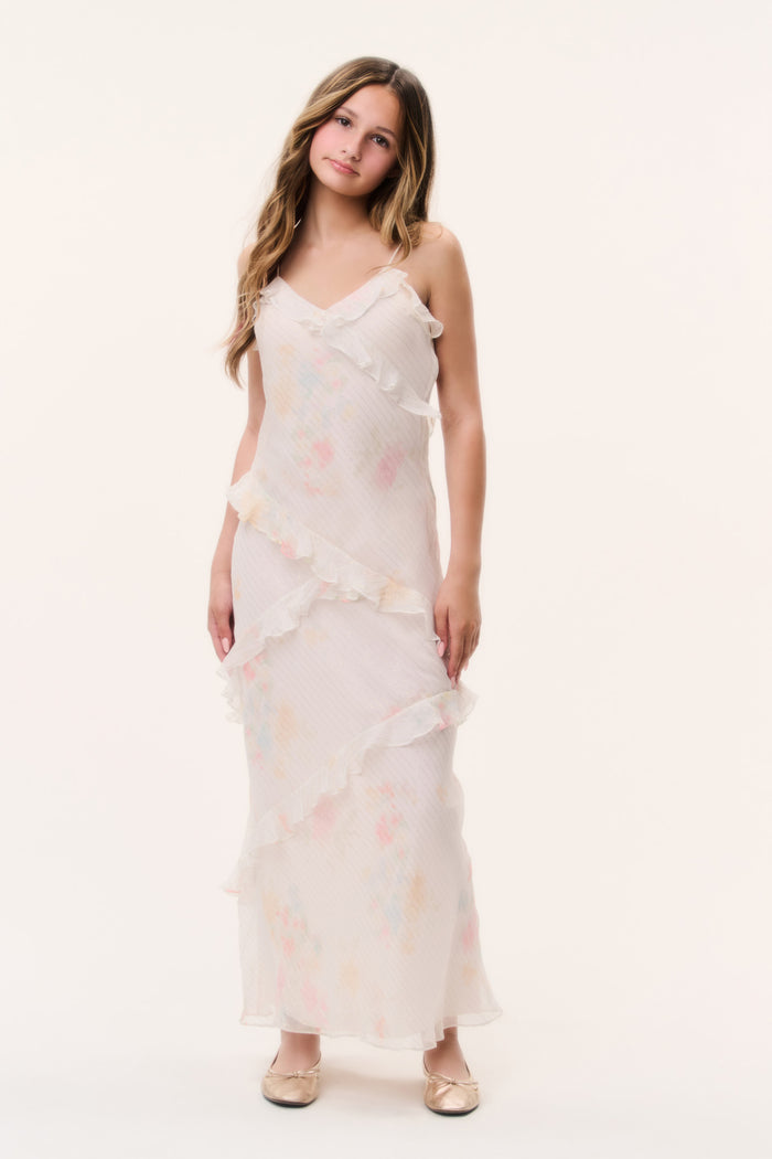 Tween silk mini dress, front view with layered ruffles and light floral print