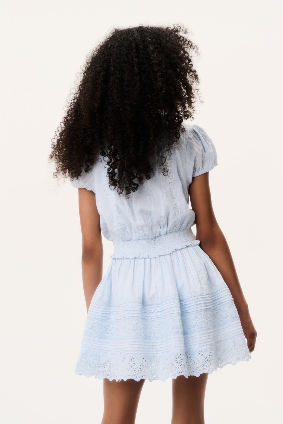 Light blue tween cotton top, back view, gathered waist and lace-trim hem