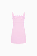 Pink lace-trim mini dress with sleeveless bodice and ruffle neckline