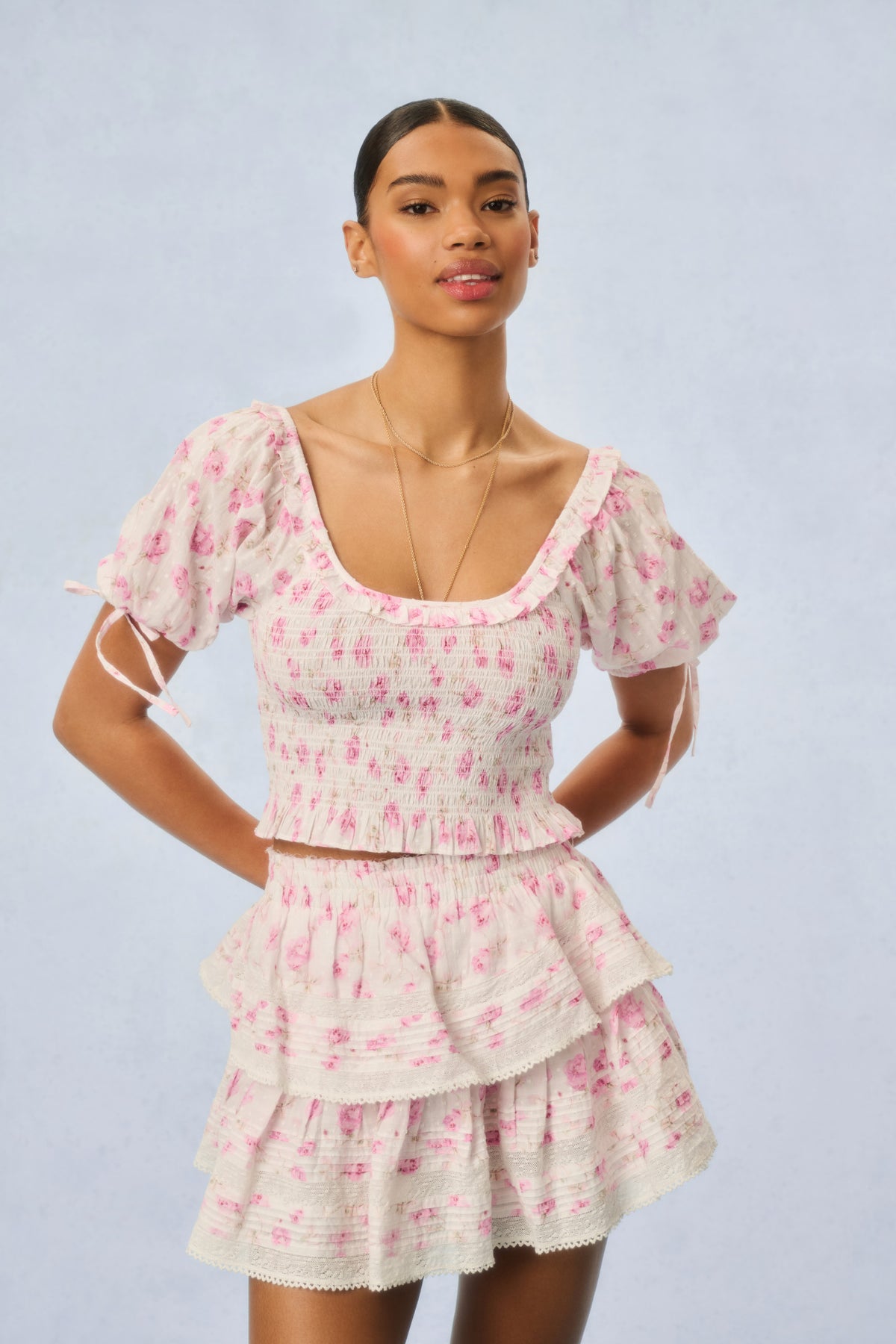 Pink floral smocked bodice tiered ruffle mini dress with short puff sleeves