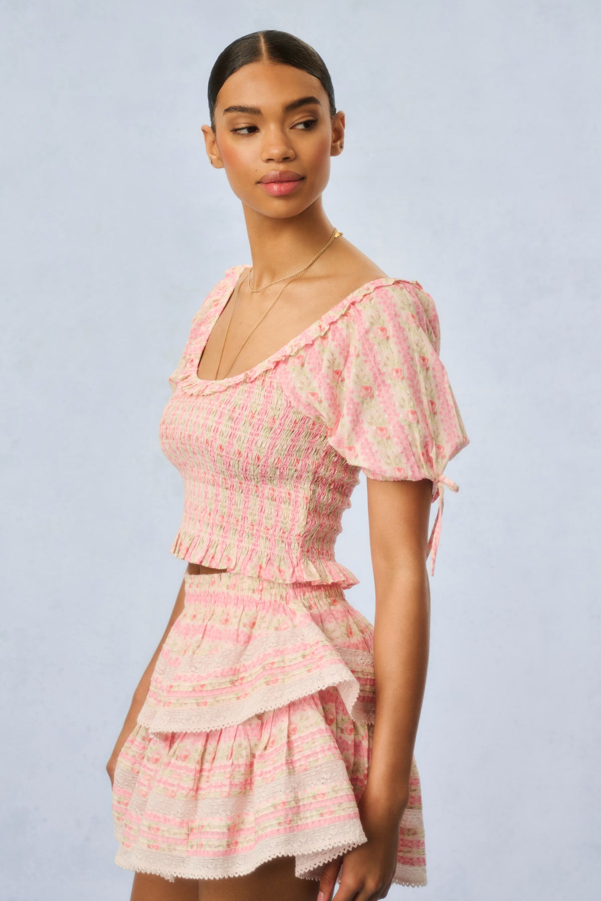 Pink floral short-sleeve smocked mini dress with tiered skirt and square neckline