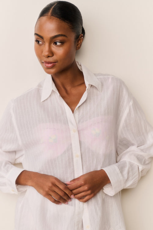 Embroidered cotton button-up shirt close-up, white collar with front button placket