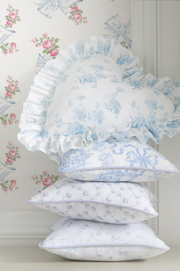 Heart-shaped ruffle pillow in light blue with delicate floral print