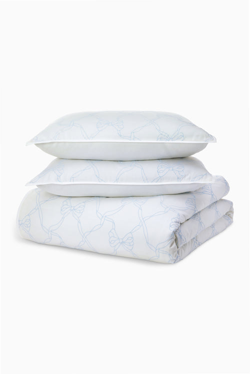 Embroidered duvet cover and sham set in light blue with subtle bow-style stitching