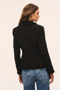 Black tweed peplum jacket back view with long sleeves and fitted waist