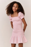 Pink gingham cotton tween dress with off-shoulder puff sleeves and tiered ruffle skirt