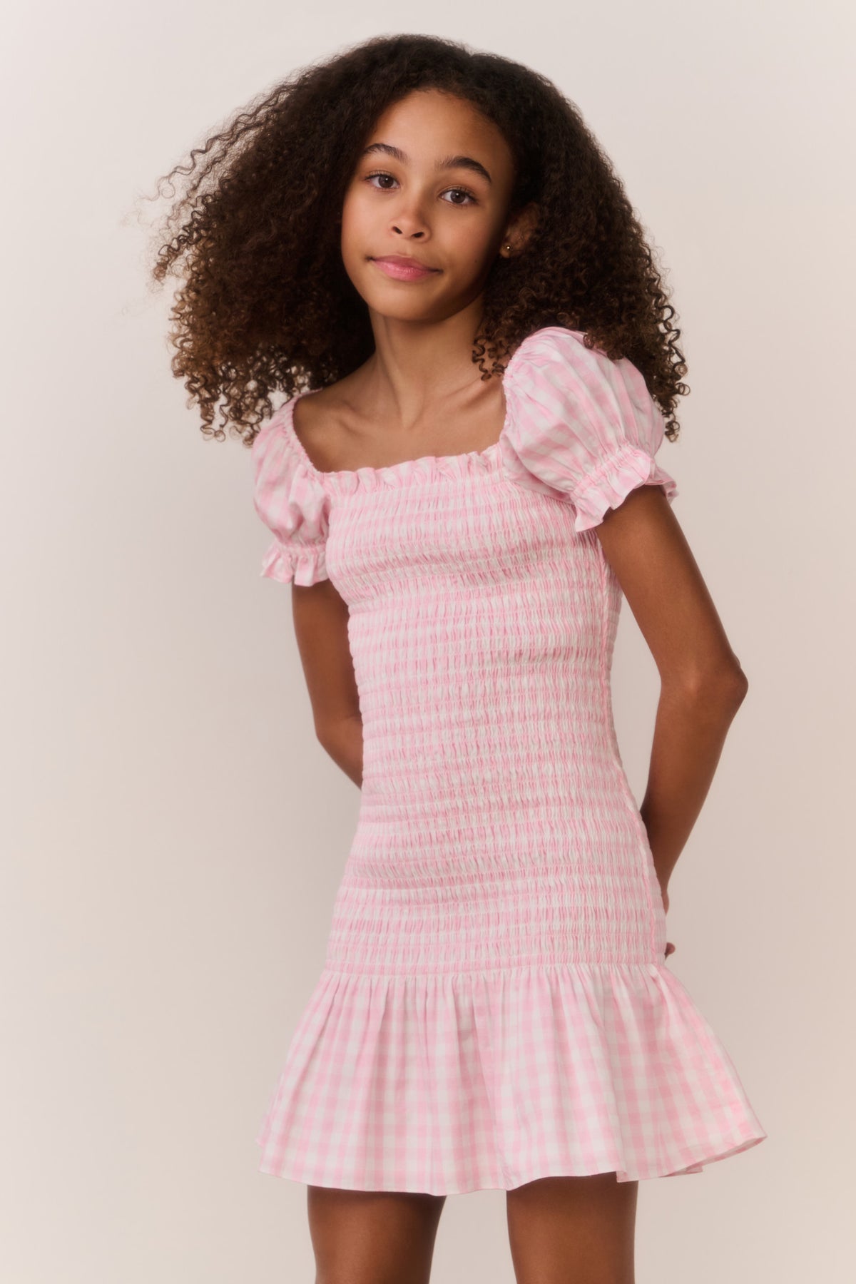 Pink gingham cotton tween dress with off-shoulder puff sleeves and tiered ruffle skirt