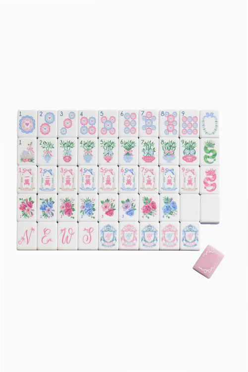 Pastel floral mahjong tile set with numbered tiles and decorative backs