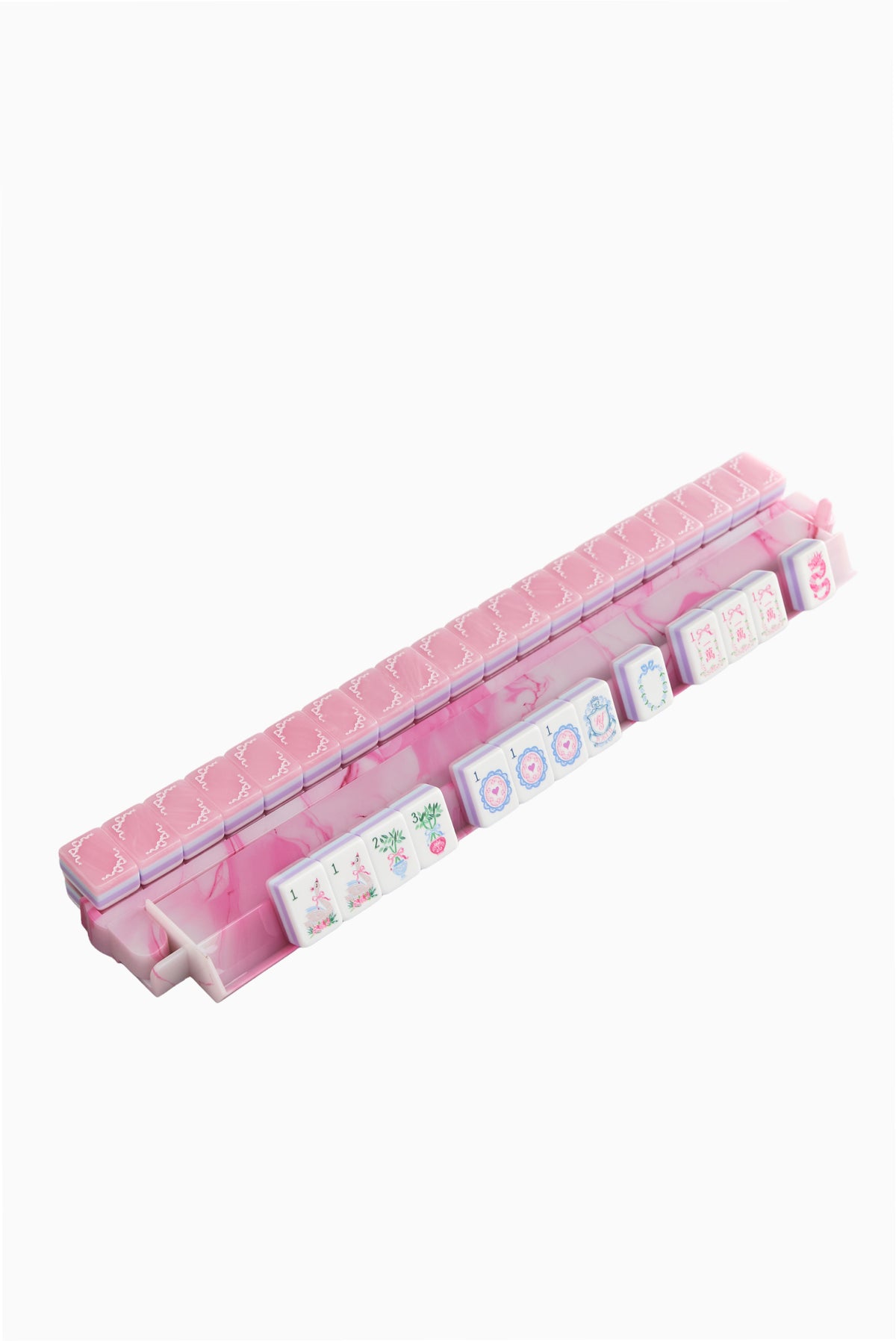 Pastel pink mahjong tile tray with striped base and printed tile backs