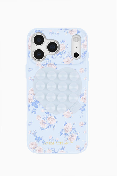 Blue floral phone case with heart-shaped suction mount and circular grip pads