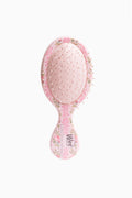 Pink floral oval hair brush with short handle and Wet logo