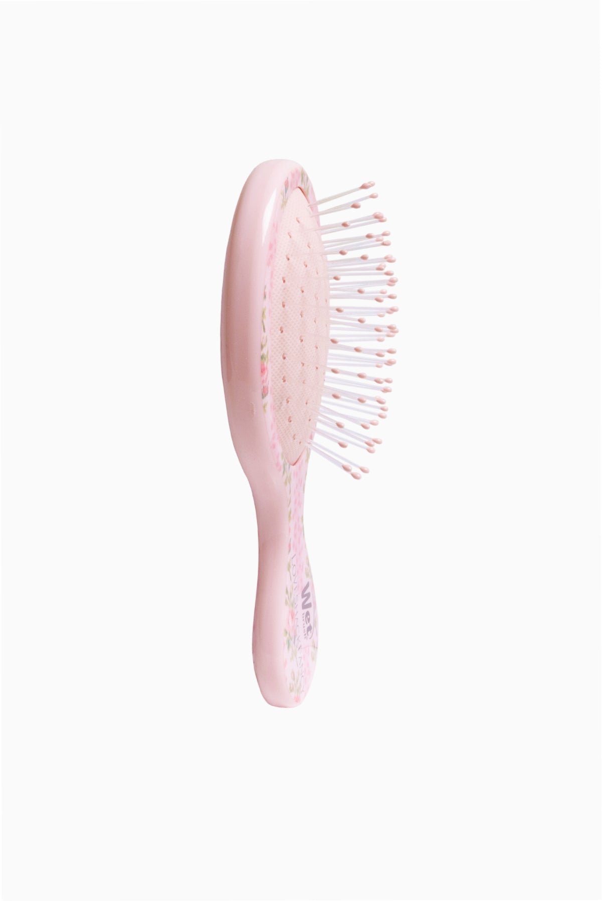 Pink floral hair detangling brush, oval back with white bristles
