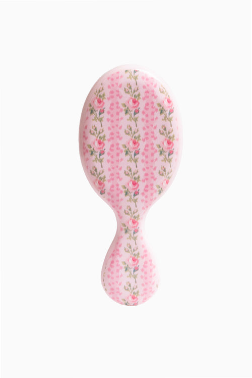 Pink floral mini detangling hair brush, oval shape with short handle