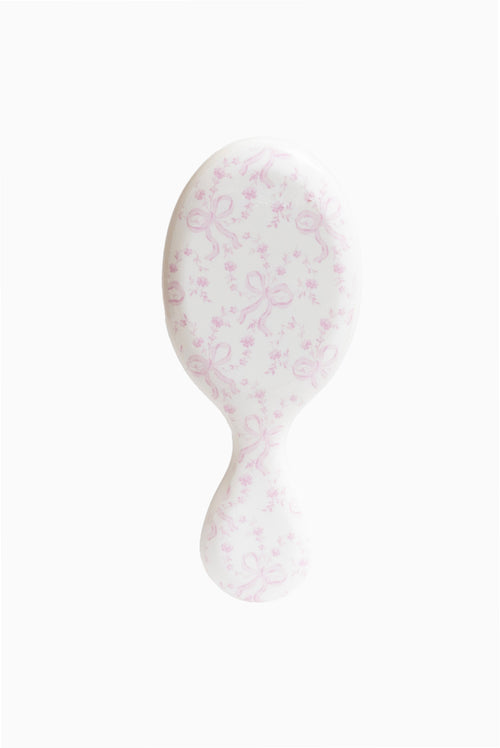 Pink floral mini detangling hair brush with padded oval head