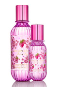 Berry Kiss mist bottles duo, berry-pink capped glass containers on reflective base